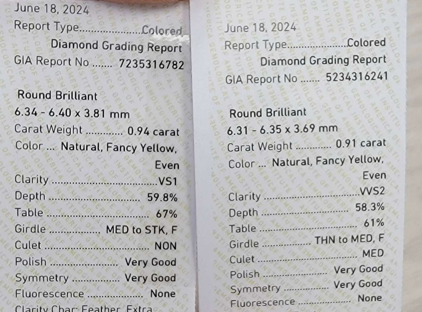 0.91ct & 0.94ct Fancy Yellow Rounds VS GIA