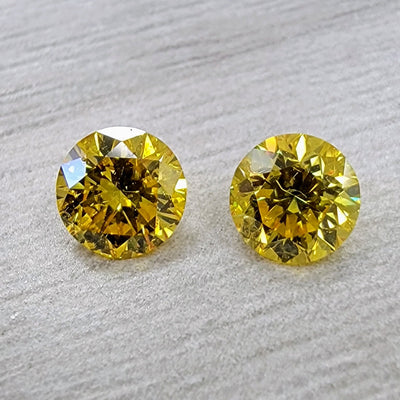 0.50ct & 0.50ct Fancy Vivid Yellow Rounds I1 GIA